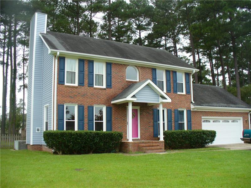 House with Brick & Blue Vinyl Siding, Fayetteville NC Siding Contractor