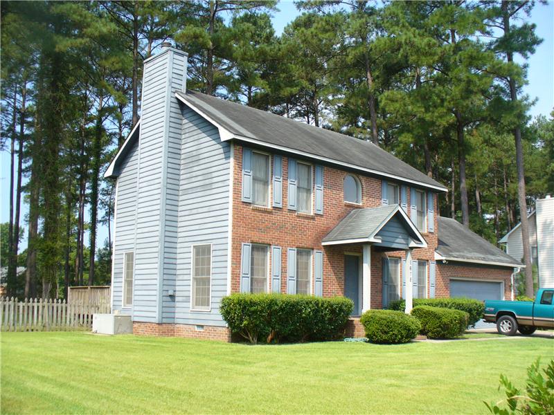 Brick House with Blue Siding, Fayetteville NC Siding Contractor