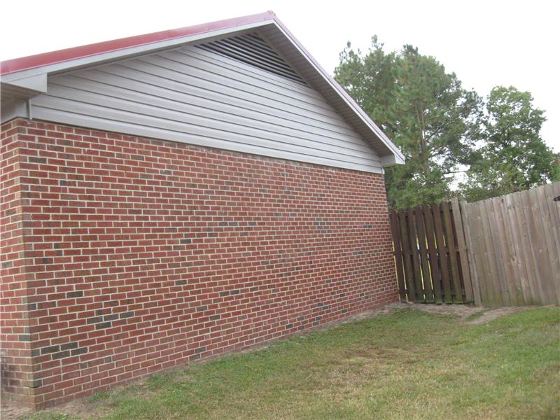 Brick House with Beige Siding, Fayetteville NC Siding Contractor