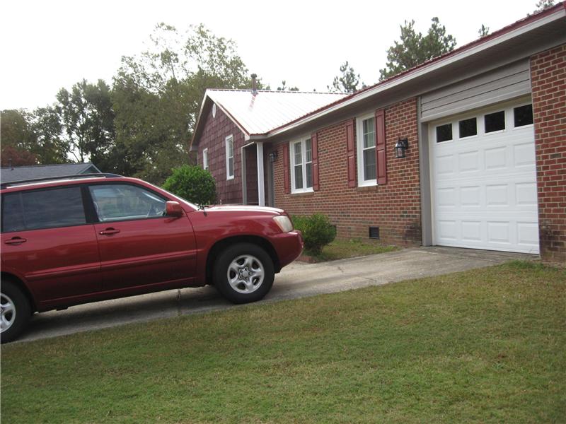 Vinyl Siding Above Garage Door, Fayetteville NC Siding Contractor