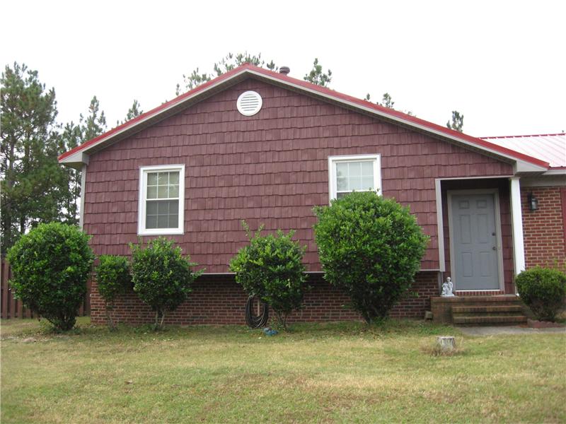 Brown Vinyl Siding on Side of Home, Fayetteville NC Siding Contractor