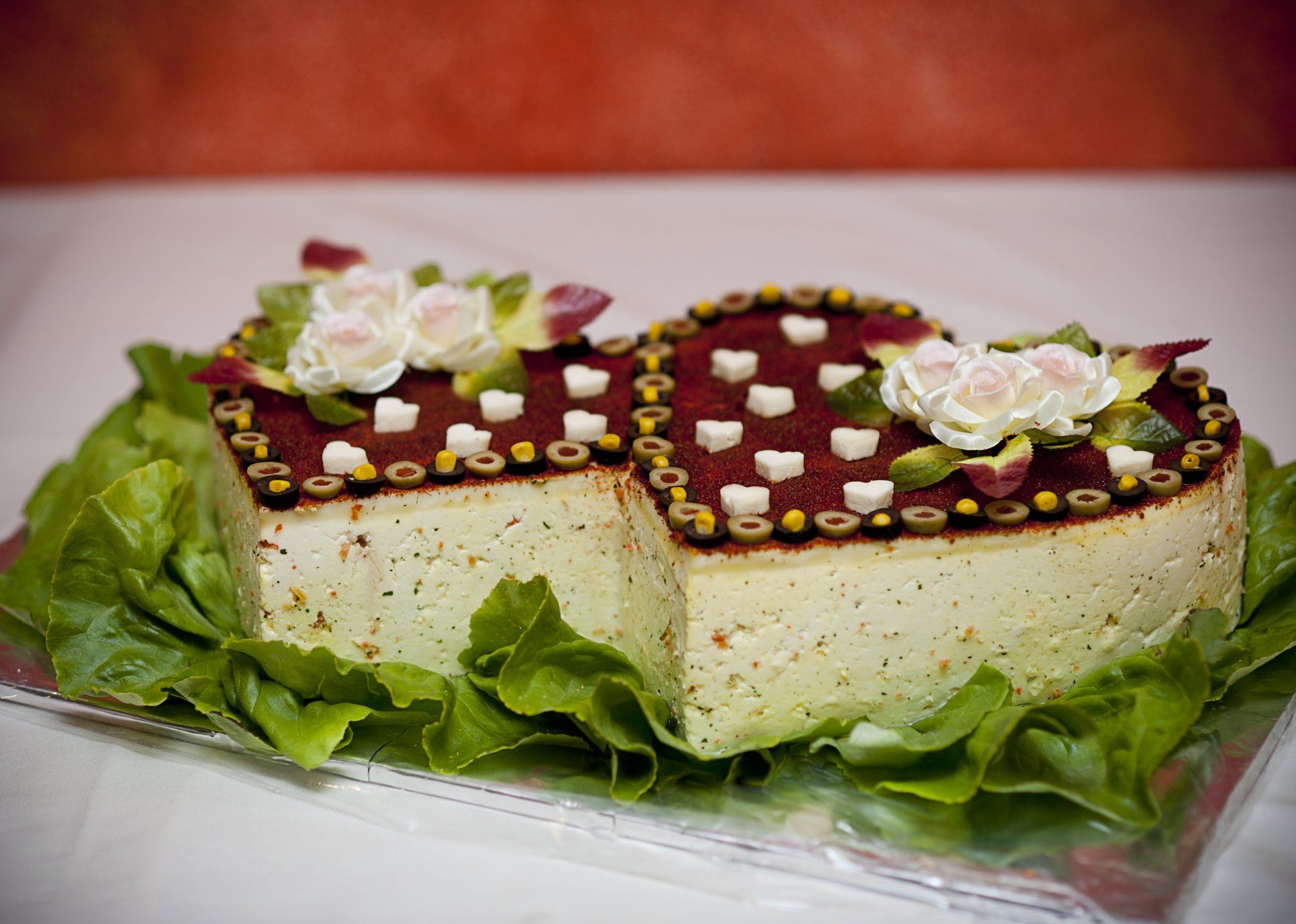 a heart shaped cake with a slice taken out of it