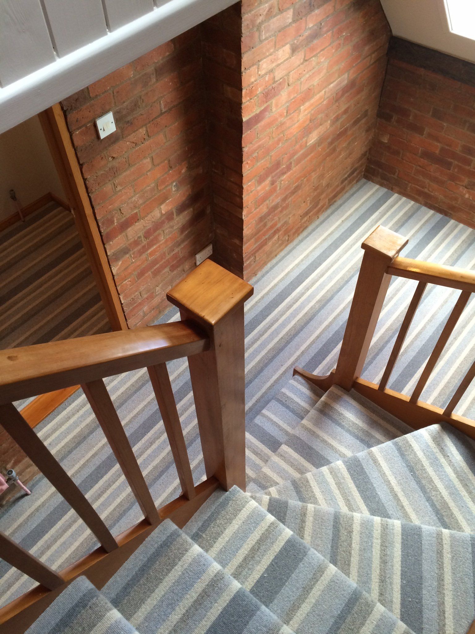 Striped carpet on stairs & landing