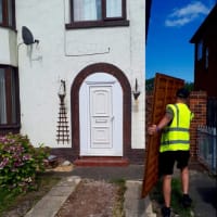 man moving fence