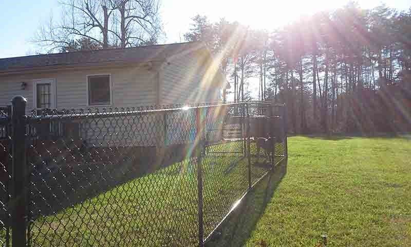 Black Vinyl Chain Link — Hickory, NC — Fister Fence of Hickory LLC