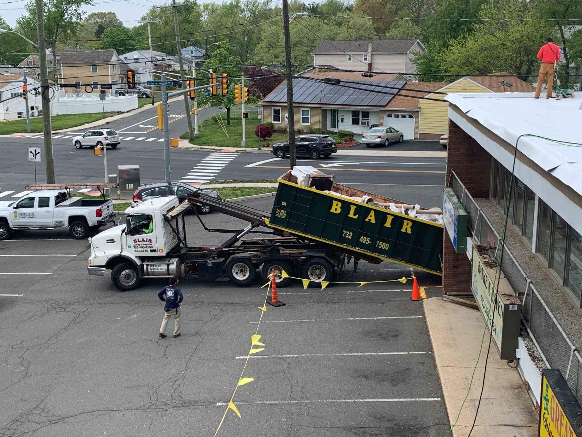Junk Removal — Junk Inside Garbage Truck in Middletown, NJ