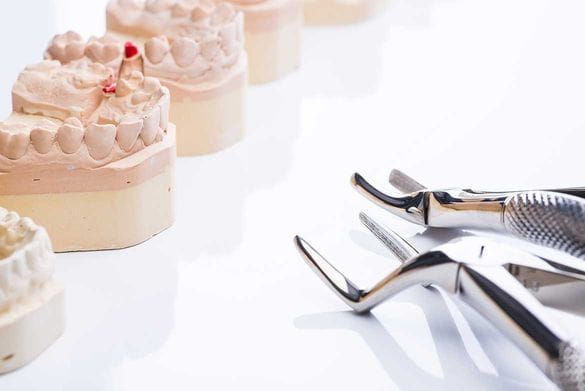 denture molding sitting on a table next to dental equipement