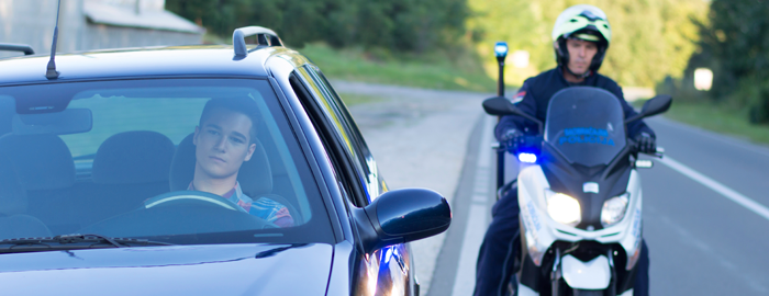 man getting pulled over by police on motorcycle