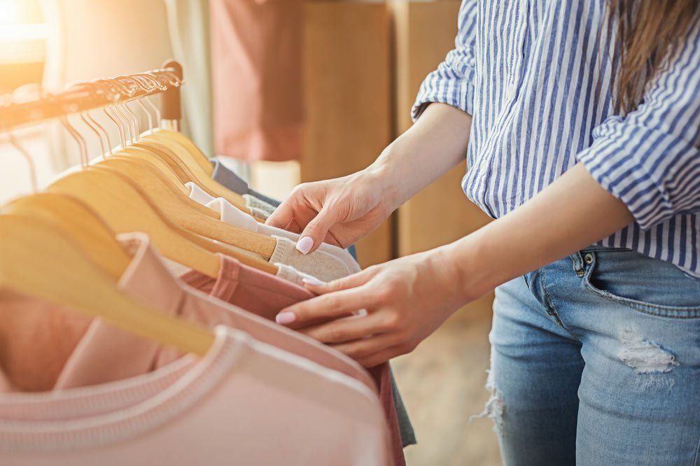Woman Choosing Clothes — Texas — Texas Tax Back Woman Choosing Clothes — Texas — Texas Tax Back