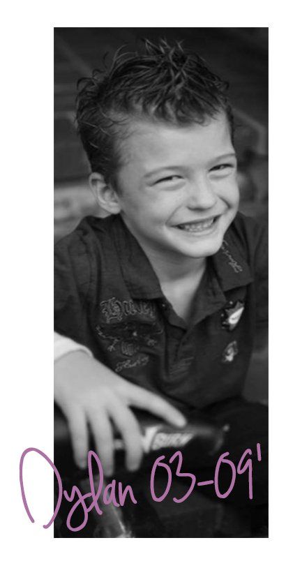 A black and white photo of a young boy with the date 03-09