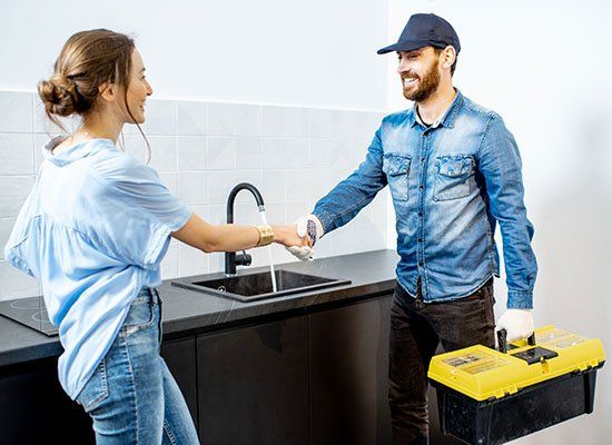 Happy Client and Worker Shaking Hands — Hatfield, MA — AM/PM Plumbing & Heating
