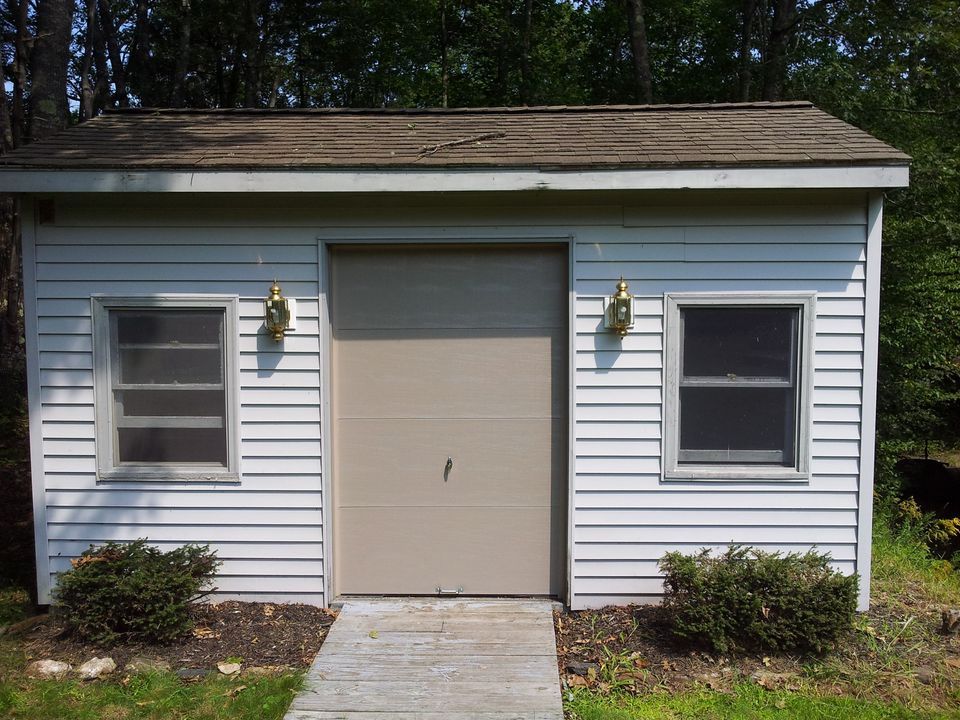 Small House With Garage Door — Portland, ME — Overhead Door Company