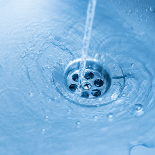 Clute Plumbers — Person Fixing Faucet in Clute, TX Clute Plumbers — Person Fixing Faucet in Clute, TX