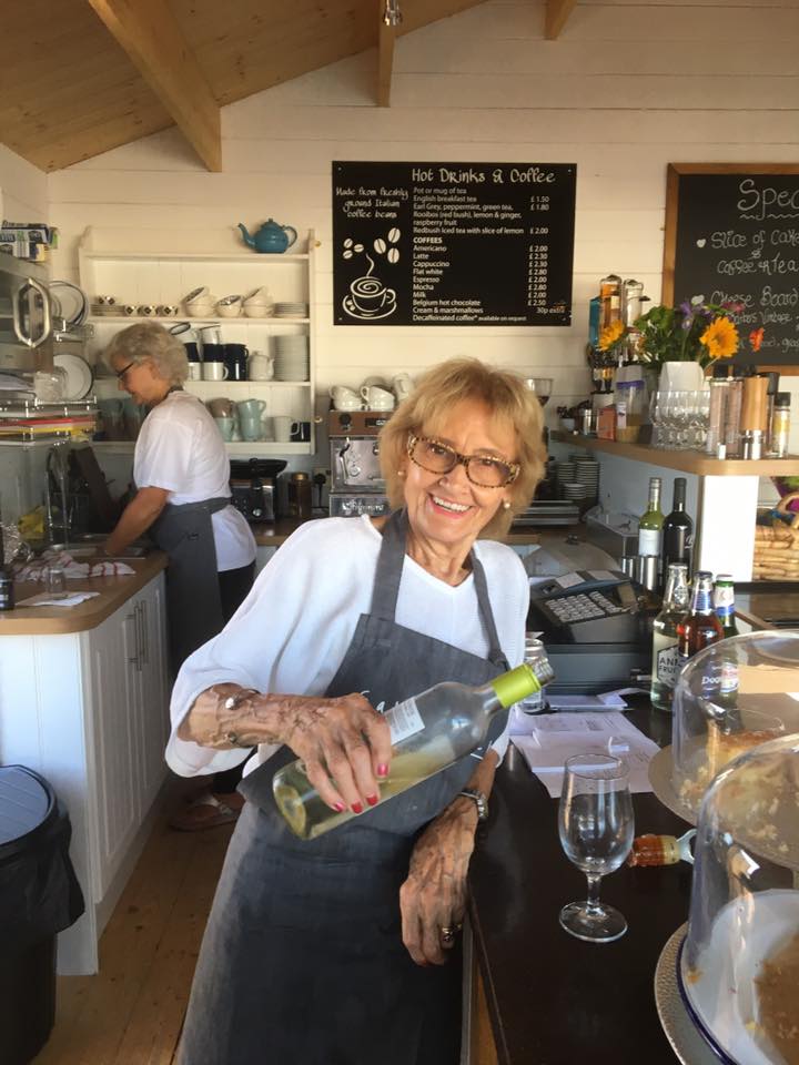 A lady pouring wine