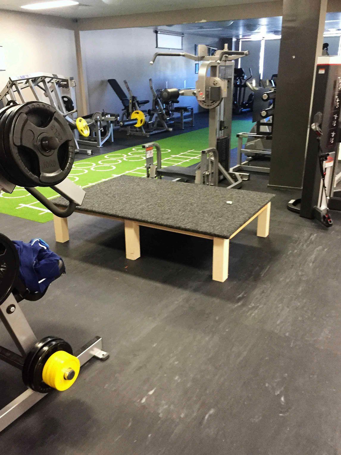 black floor and black table inside gym