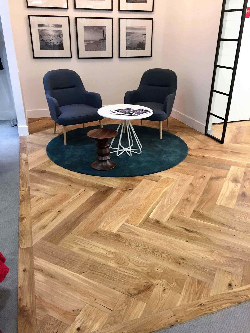 light brown floor with two blue chairs