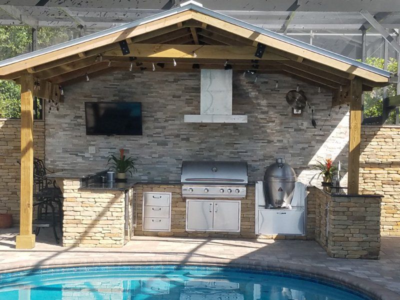 Outdoor Kitchen Near a Pool — Clermont, FL — Florida Dock & Boat Lifts