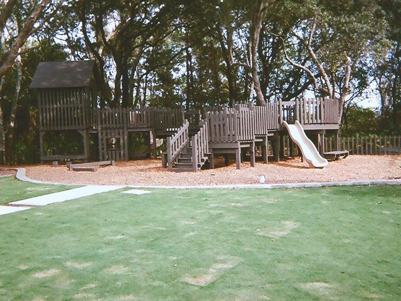 Wooden Slide on a Playground — Clermont, FL — Florida Dock & Boat Lifts