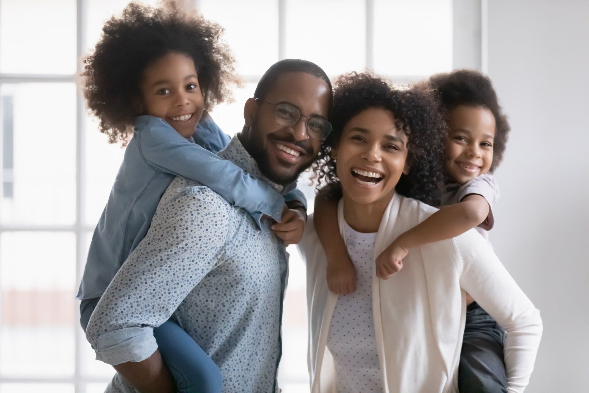 White Teeth of Smiling Family — Colorado Springs, CO — Smile Heart Dental Hygiene White Teeth of Smiling Family — Colorado Springs, CO — Smile Heart Dental Hygiene