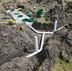 Septic Services in Alvin — A Man Repairing a Septic Tube in Alvin, TX