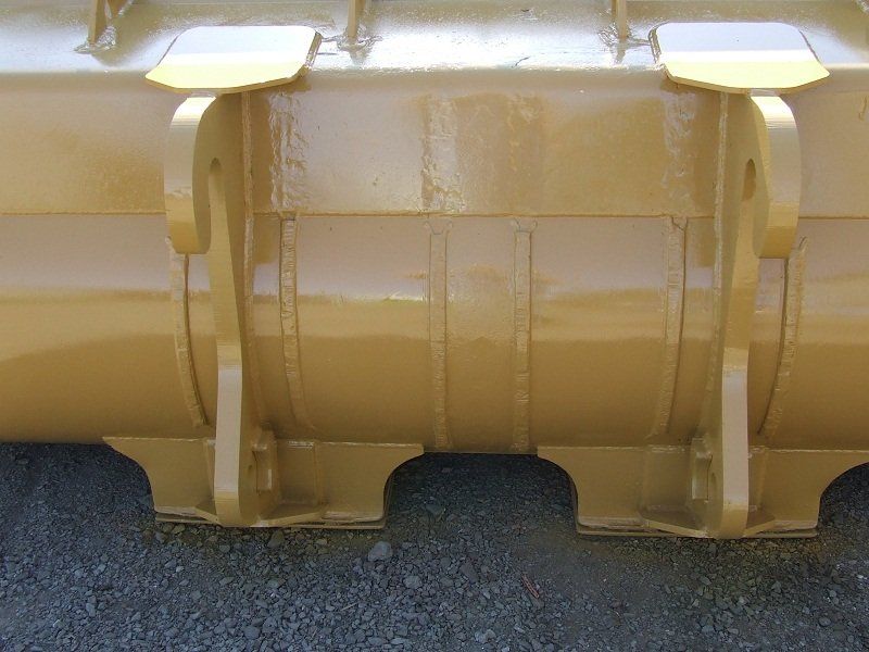 A close up of a metal object with a yellow sticker on it