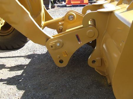 A close up of a yellow tractor with a sticker that says ' a ' on it