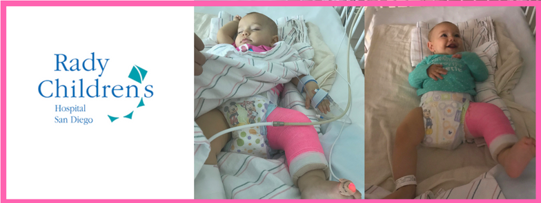 A baby with a cast on her leg is laying in a hospital bed