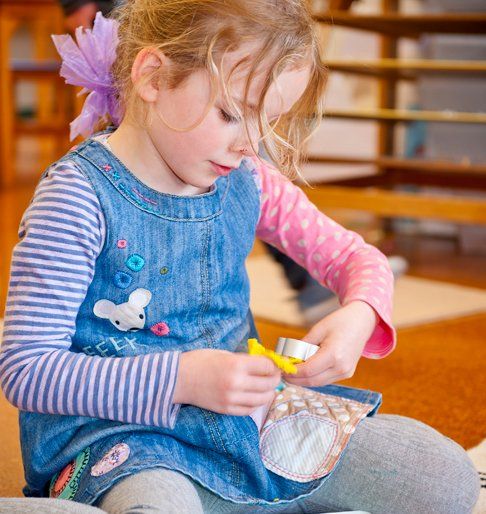 Little girl playing with her toy