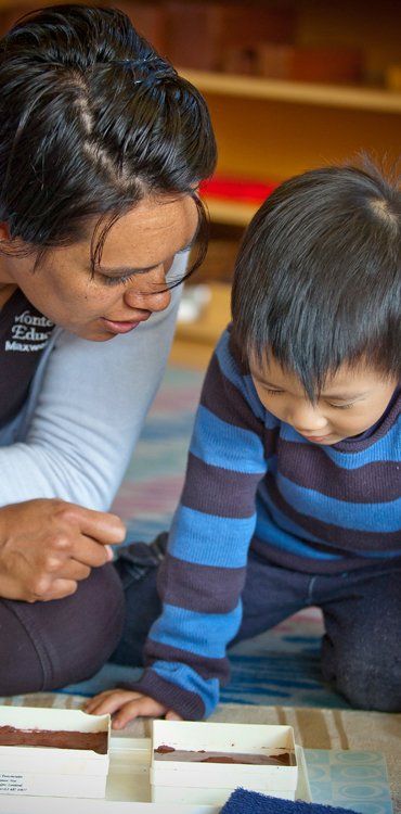 Little kid with his teacher