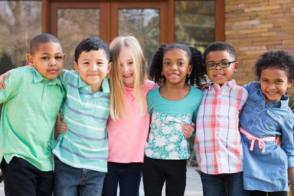 group of elementary age children smiling
