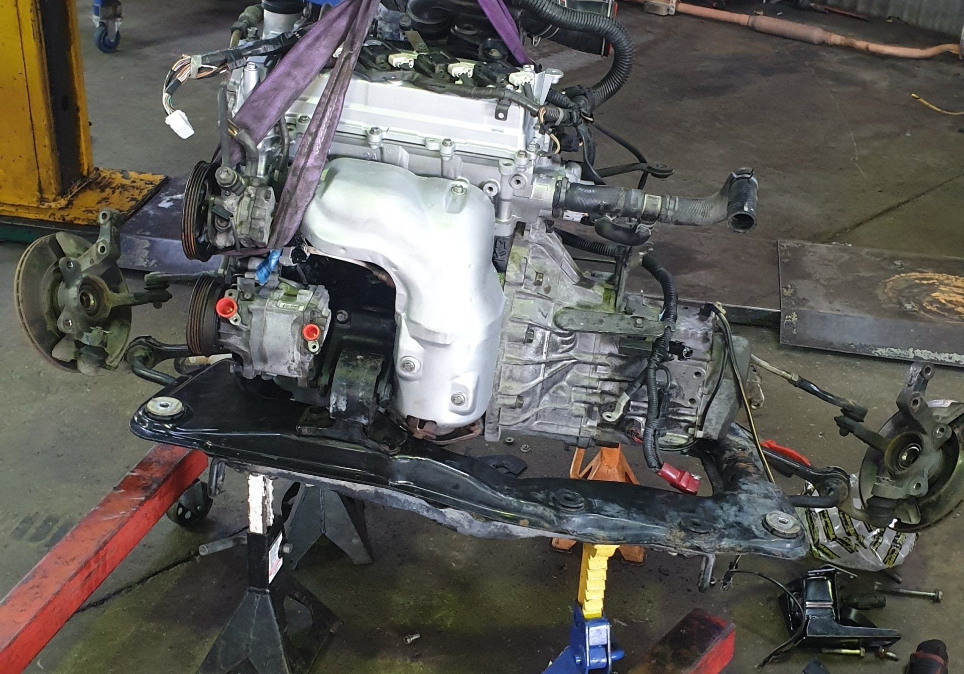 Engine on Hoist for Repair Work - Specialist Mechanics in Cairns, QLD