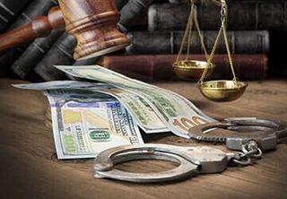 Cash and handcuffs — Criminal Law in Fremont, NE