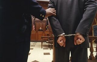 Man in handcuffs — Criminal Law in Fremont, NE