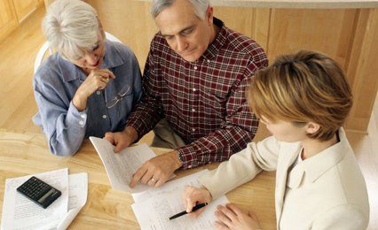 A female accountant advising a couple