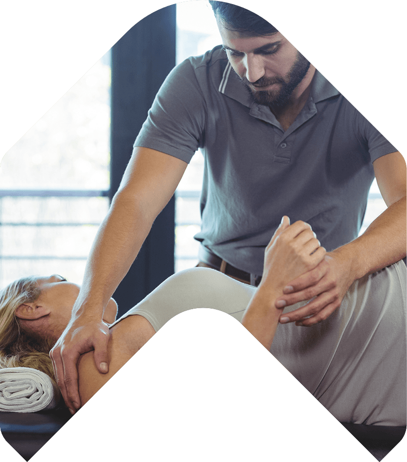 A man is giving a woman a massage on her back.