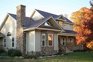 House with blue roof — Metal roofs in Riceville, TN