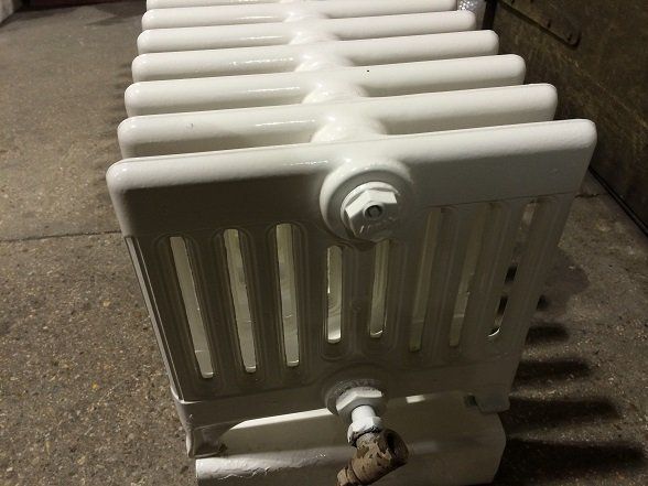 Radiator shot blasted, primed and top coated