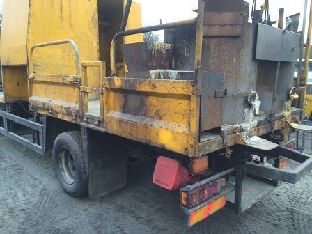 Works lorry in need of surface repair