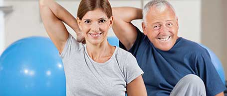 Sport Group Doing Back Exercises in Gym — Physical Therapy Center in Huntington, NY Sport Group Doing Back Exercises in Gym — Physical Therapy Center in Huntington, NY