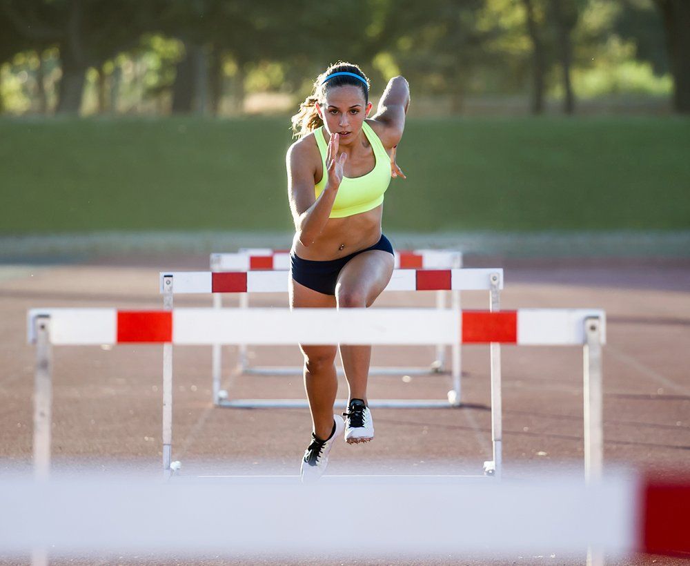 Woman Running on Field — DFW, TX — Texas Non-Surgical Orthopedic Woman Running on Field — DFW, TX — Texas Non-Surgical Orthopedic
