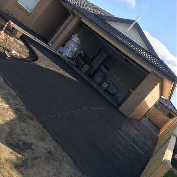 freshly paved concrete driveway