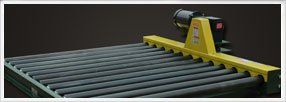 Chain Driven Conveyors — Yellow Chain Driven Conveyors In Shipping Area In Fort Worth, Tx Chain Driven Conveyors — Yellow Chain Driven Conveyors In Shipping Area In Fort Worth, Tx