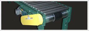 Flat Belt Driven Conveyors — Green Flat Belt Driven Conveyors In Shipping Area In Fort Worth, Tx Flat Belt Driven Conveyors — Green Flat Belt Driven Conveyors In Shipping Area In Fort Worth, Tx