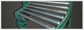 V-Belt Driven Conveyors — Green V-Belt Driven Conveyors In Shipping Area In Fort Worth, Tx V-Belt Driven Conveyors — Green V-Belt Driven Conveyors In Shipping Area In Fort Worth, Tx
