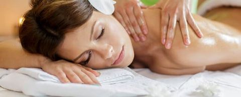 Woman Receiving Back Massage — Massage Therapy in Edina, MN Woman Receiving Back Massage — Massage Therapy in Edina, MN