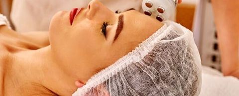 Young Woman Receiving Ultrasound Therapy Female Doctor — Massage Therapy in Edina, MN Young Woman Receiving Ultrasound Therapy Female Doctor — Massage Therapy in Edina, MN