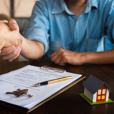 Estate Agent Shaking Hands with Customer — Ormond Beach, FL — Korey Sweet McKinnon & Simpson Estate Agent Shaking Hands with Customer — Ormond Beach, FL — Korey Sweet McKinnon & Simpson