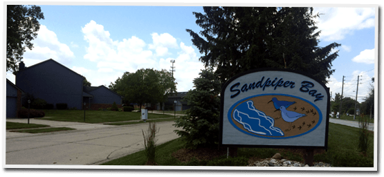 A sign that says sandpiper bay on it