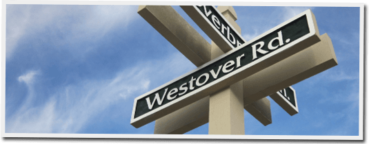 A street sign for westover road against a blue sky