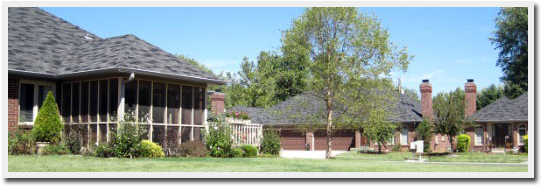 A picture of a house with a screened in porch